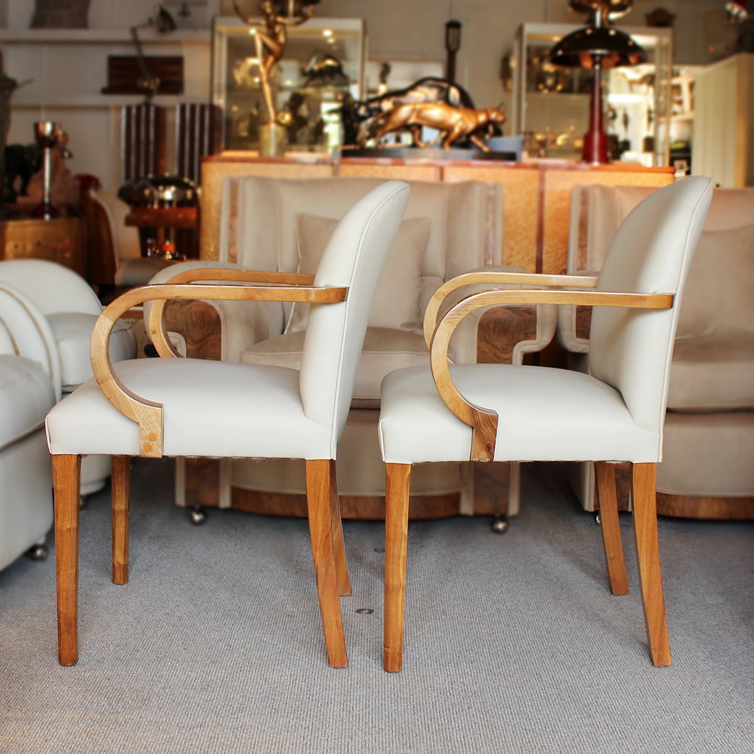 A pair of Art Deco side chairs with curved walnut arms
