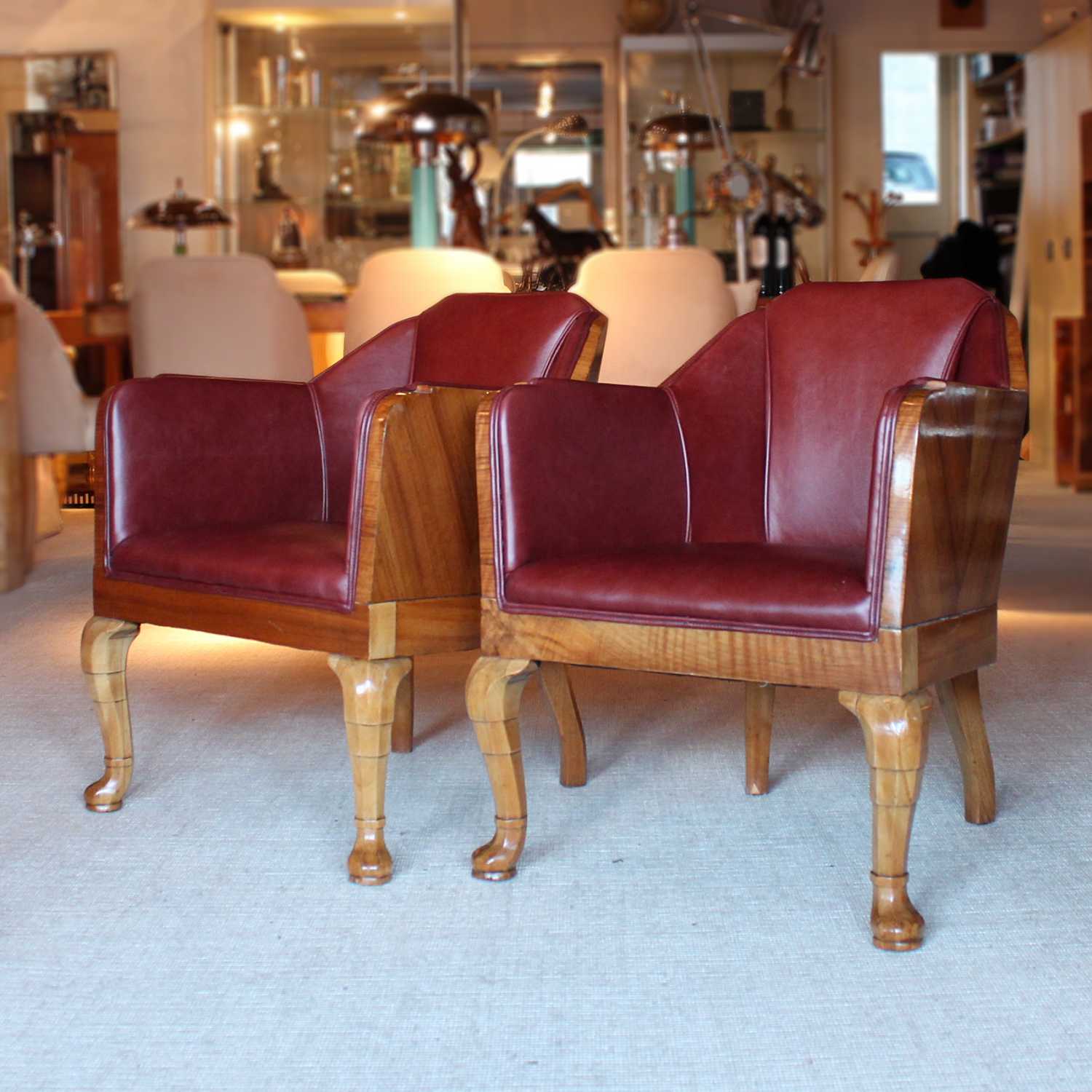 Art Deco side chairs in chestnut leather with curved walnut legs at Jeroen Markies