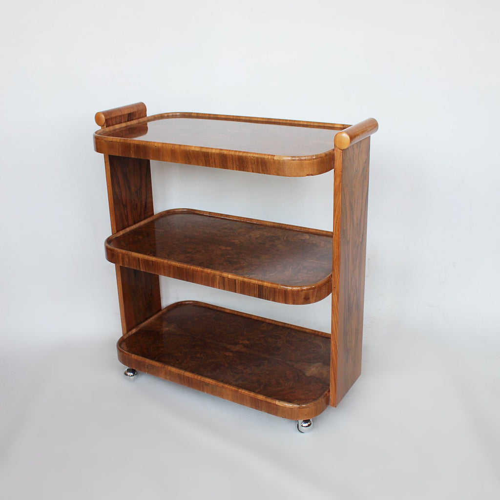 An Art Deco serving trolley with three shelves in burr walnut at Jeroen Markies