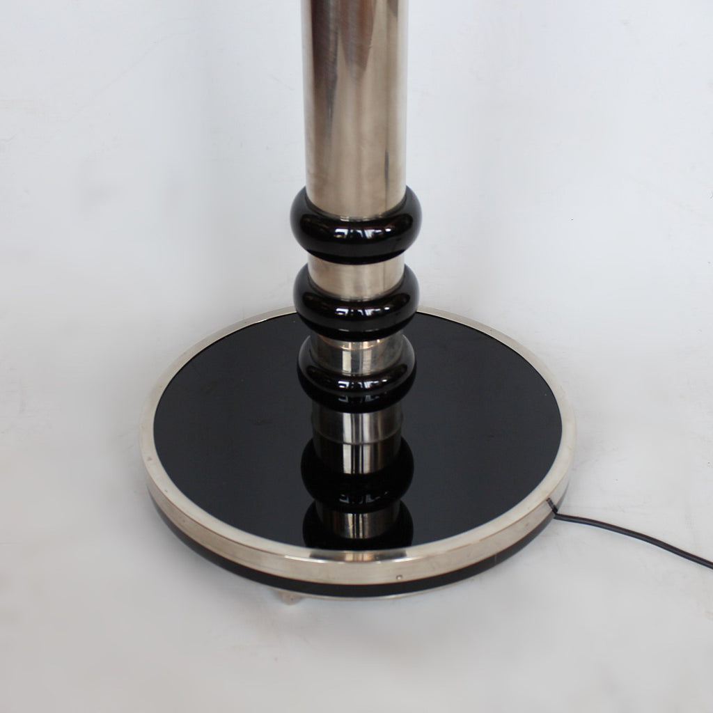 An Art Deco uplighter torchiere floor lamp in chromed metal and black bakelite at Jeroen Markies 