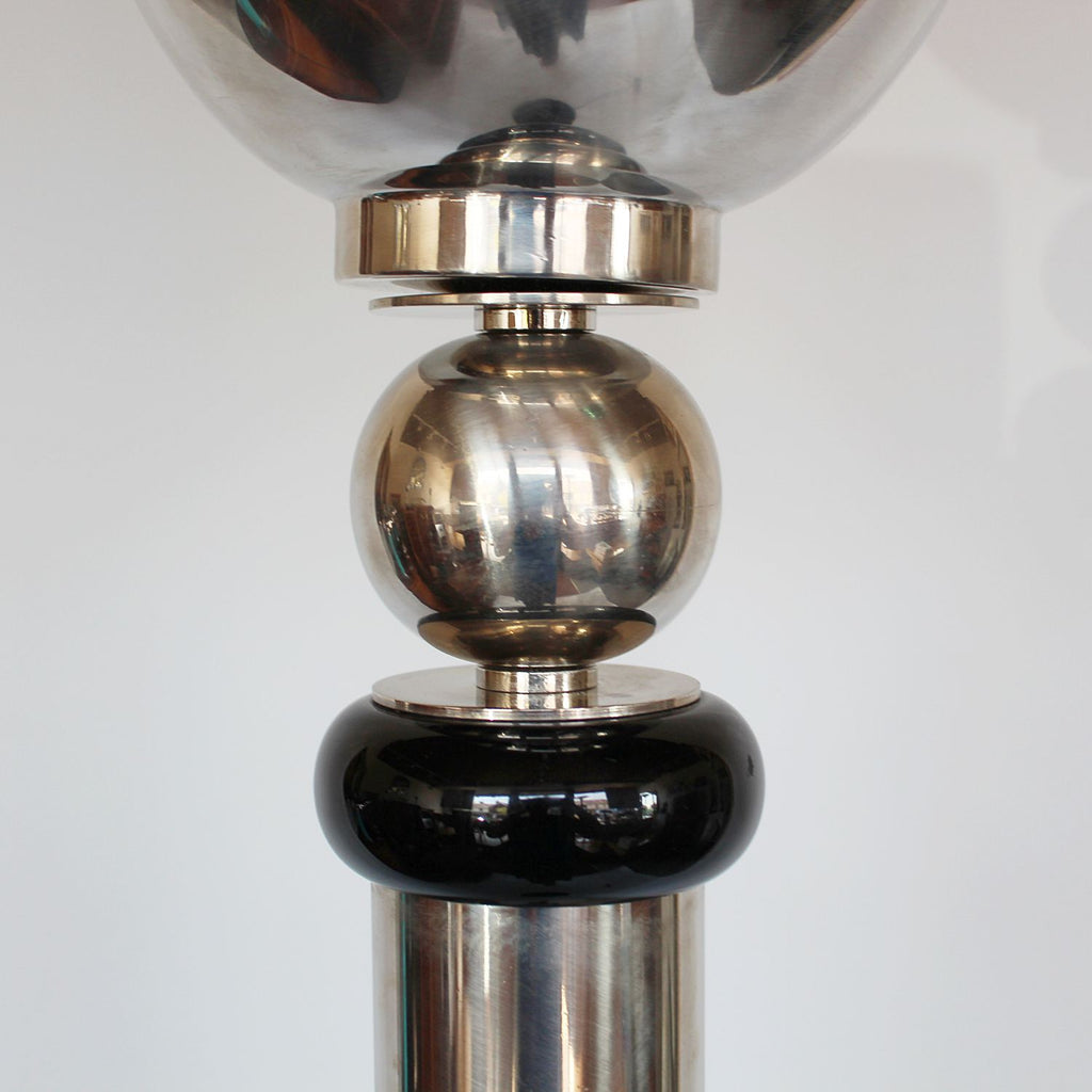 An Art Deco uplighter torchiere floor lamp in chromed metal and black bakelite at Jeroen Markies 