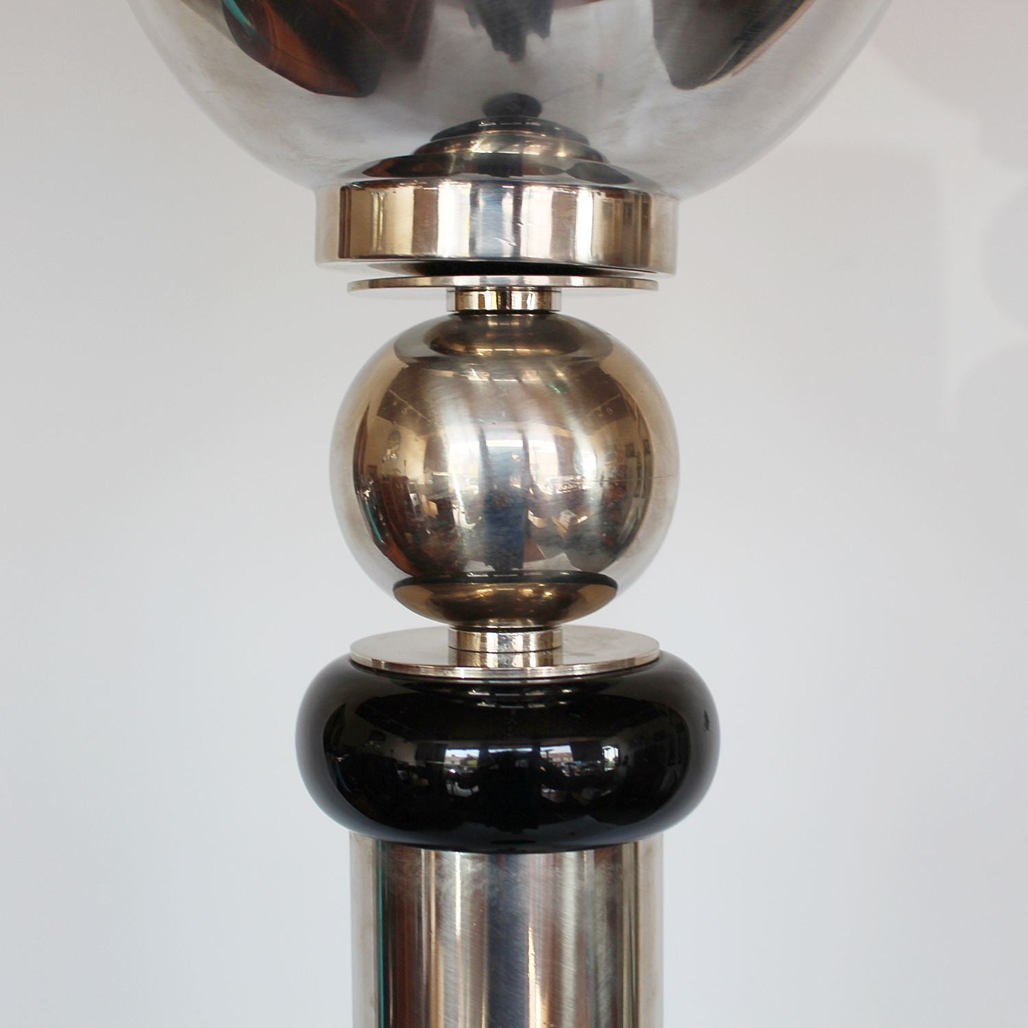 An Art Deco uplighter torchiere floor lamp in chromed metal and black bakelite at Jeroen Markies 