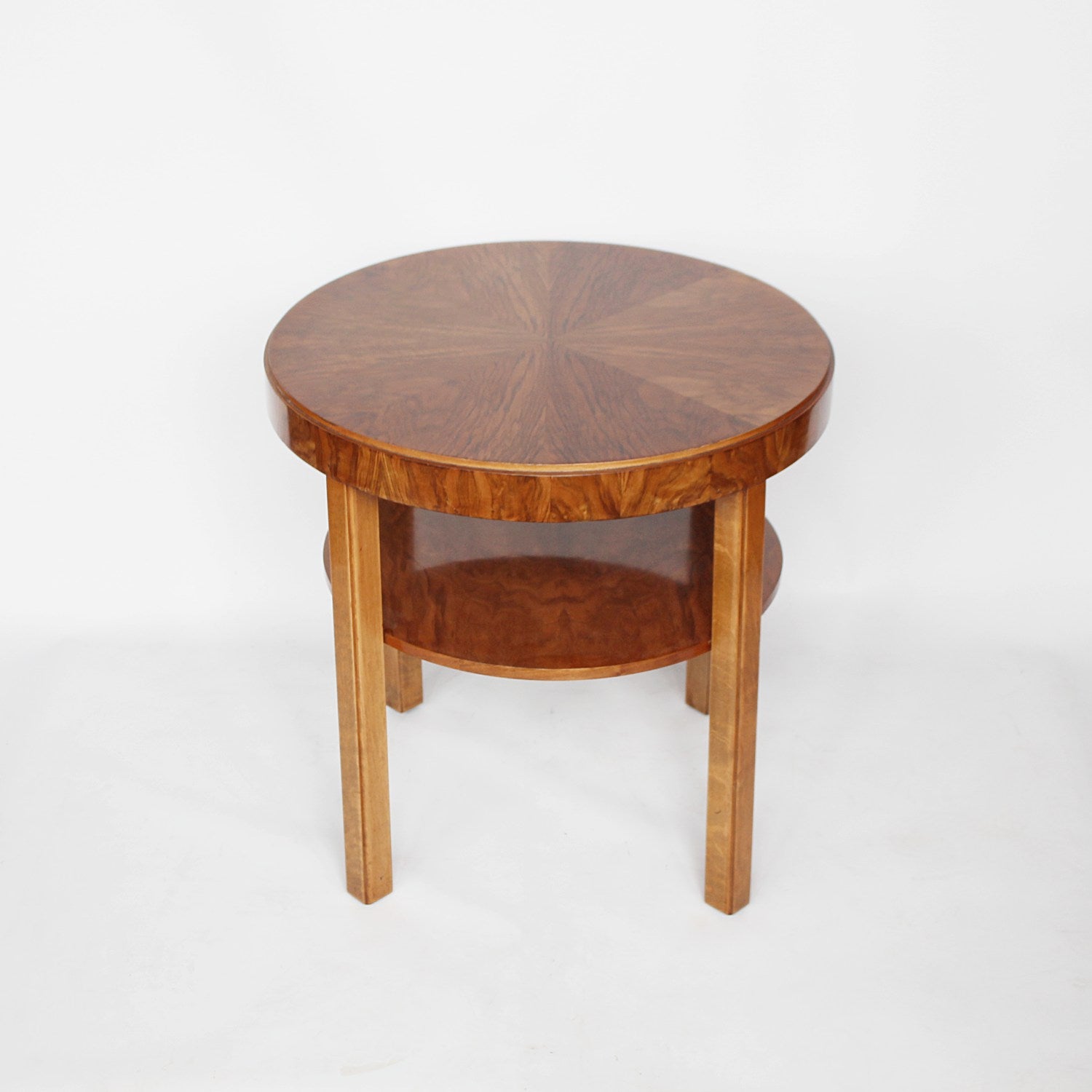 An Art Deco circular side table with shelf circa 1930