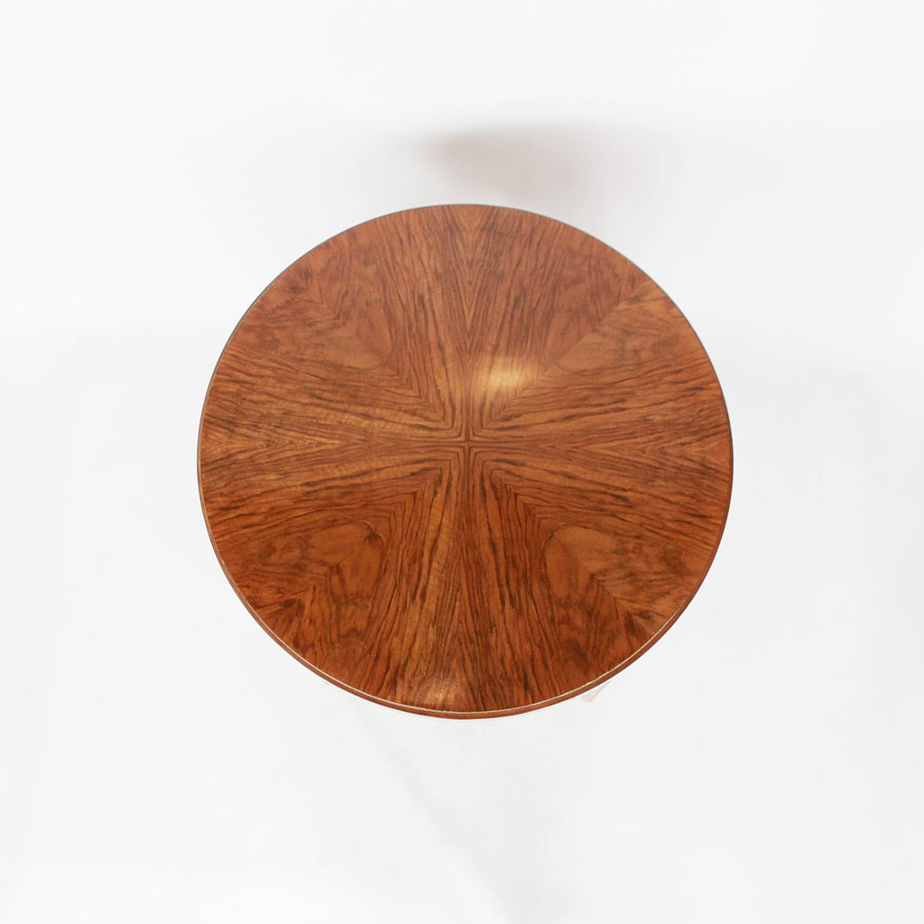 An Art Deco circular side table with shelf circa 1930