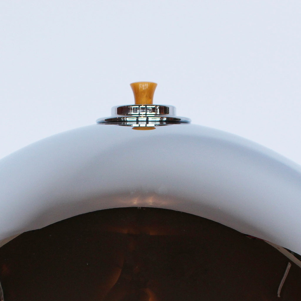 A pair of large Art Deco dome lamps with fluted bakelite stems and chromed metal domes at Jeroen Markies