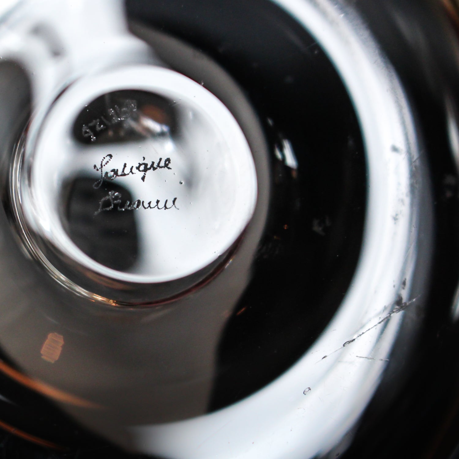 Detailed crystal ring dish by Lalique. Clear dish base topped with a frosted crystal Partridge. Signed to base at Jeroen Markies.