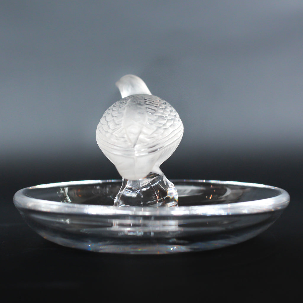 Detailed crystal ring dish by Lalique. Clear dish base topped with a frosted crystal Partridge. Signed to base at Jeroen Markies.