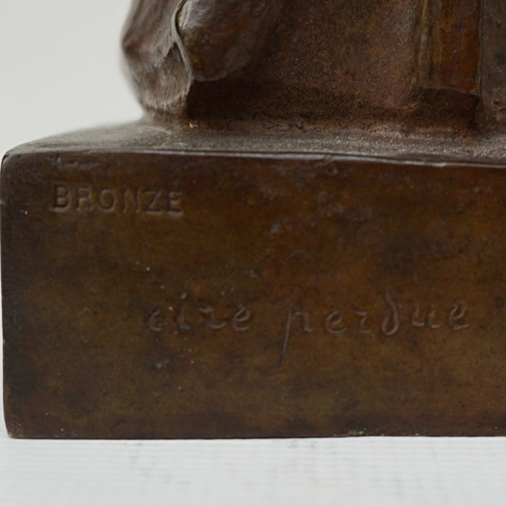 An Art Deco bronze sculpture of Ceres the Roman goddess of agriculture, fertility and motherly relationshios, holding alot a strand of wheat, bear breasted with a shawl around her and her hair flowing in the wind by André Bizette-Lindet 