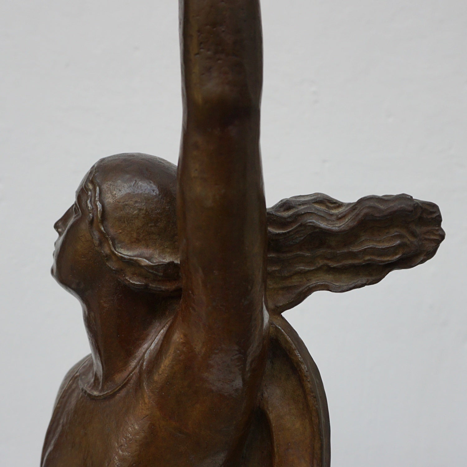 An Art Deco bronze sculpture of Ceres the Roman goddess of agriculture, fertility and motherly relationshios, holding alot a strand of wheat, bear breasted with a shawl around her and her hair flowing in the wind by André Bizette-Lindet 