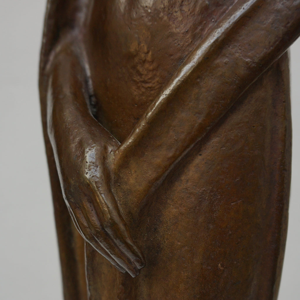 An Art Deco bronze sculpture of Ceres the Roman goddess of agriculture, fertility and motherly relationshios, holding alot a strand of wheat, bear breasted with a shawl around her and her hair flowing in the wind by André Bizette-Lindet 