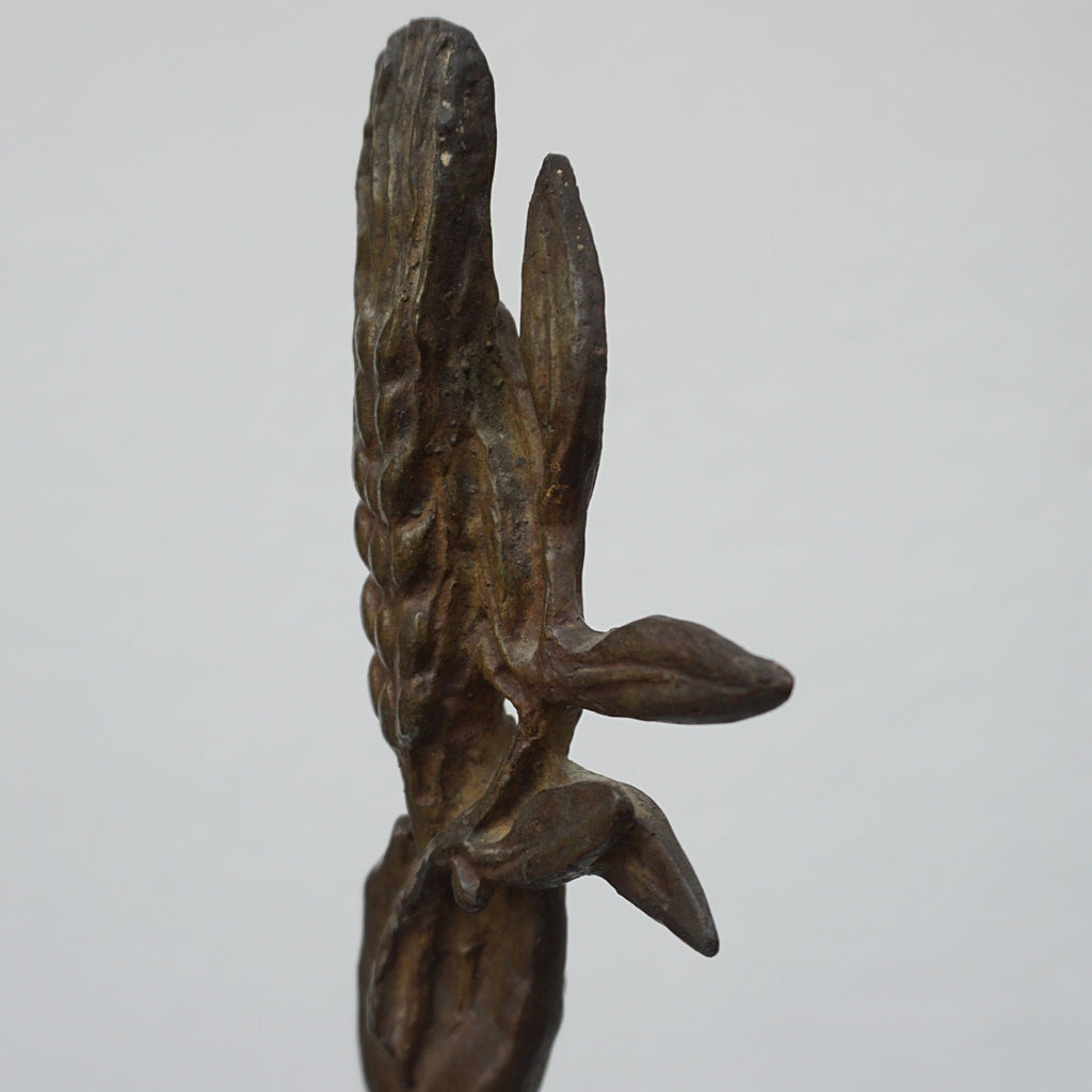An Art Deco bronze sculpture of Ceres the Roman goddess of agriculture, fertility and motherly relationshios, holding alot a strand of wheat, bear breasted with a shawl around her and her hair flowing in the wind by André Bizette-Lindet 