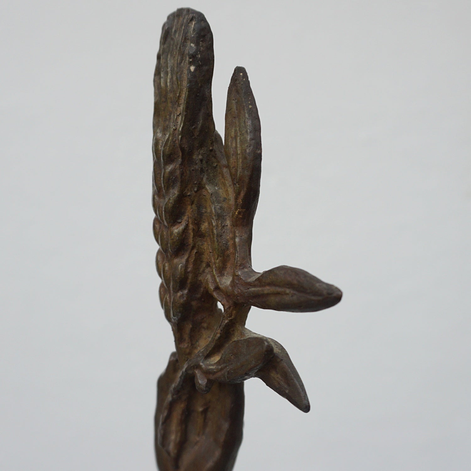 An Art Deco bronze sculpture of Ceres the Roman goddess of agriculture, fertility and motherly relationshios, holding alot a strand of wheat, bear breasted with a shawl around her and her hair flowing in the wind by André Bizette-Lindet 