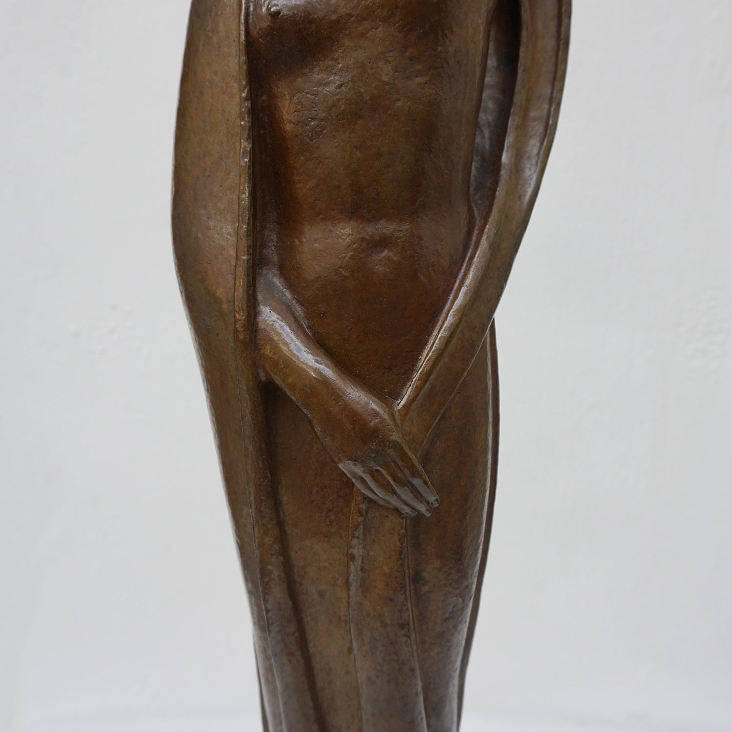An Art Deco bronze sculpture of Ceres the Roman goddess of agriculture, fertility and motherly relationshios, holding alot a strand of wheat, bear breasted with a shawl around her and her hair flowing in the wind by André Bizette-Lindet 