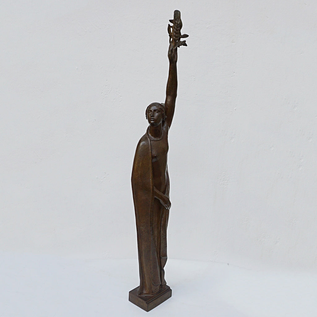 An Art Deco bronze sculpture of Ceres the Roman goddess of agriculture, fertility and motherly relationshios, holding alot a strand of wheat, bear breasted with a shawl around her and her hair flowing in the wind by André Bizette-Lindet 
