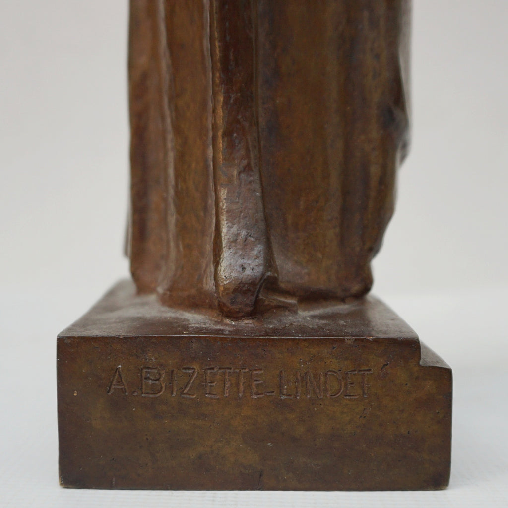 An Art Deco bronze sculpture of Ceres the Roman goddess of agriculture, fertility and motherly relationshios, holding alot a strand of wheat, bear breasted with a shawl around her and her hair flowing in the wind by André Bizette-Lindet 