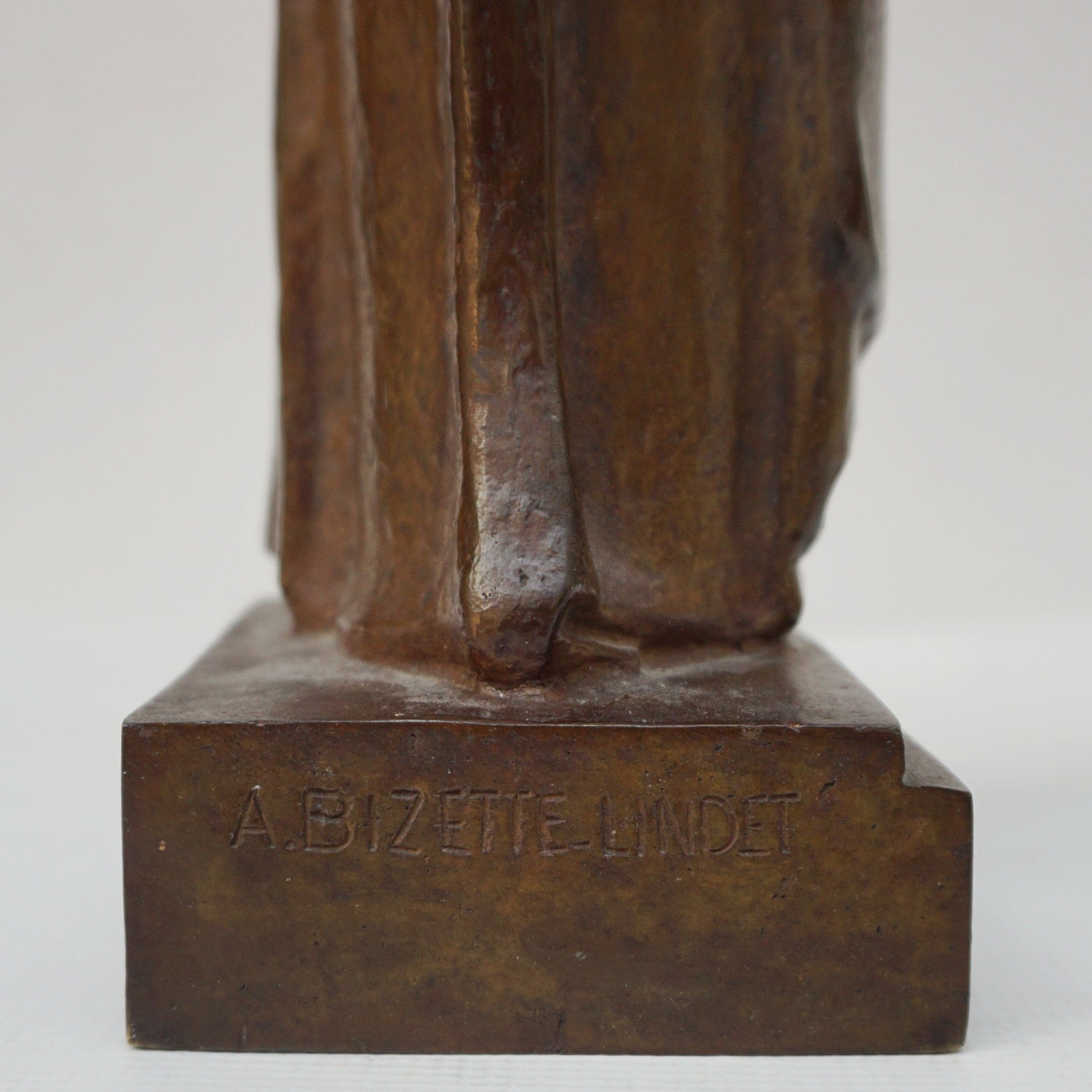 An Art Deco bronze sculpture of Ceres the Roman goddess of agriculture, fertility and motherly relationshios, holding alot a strand of wheat, bear breasted with a shawl around her and her hair flowing in the wind by André Bizette-Lindet 