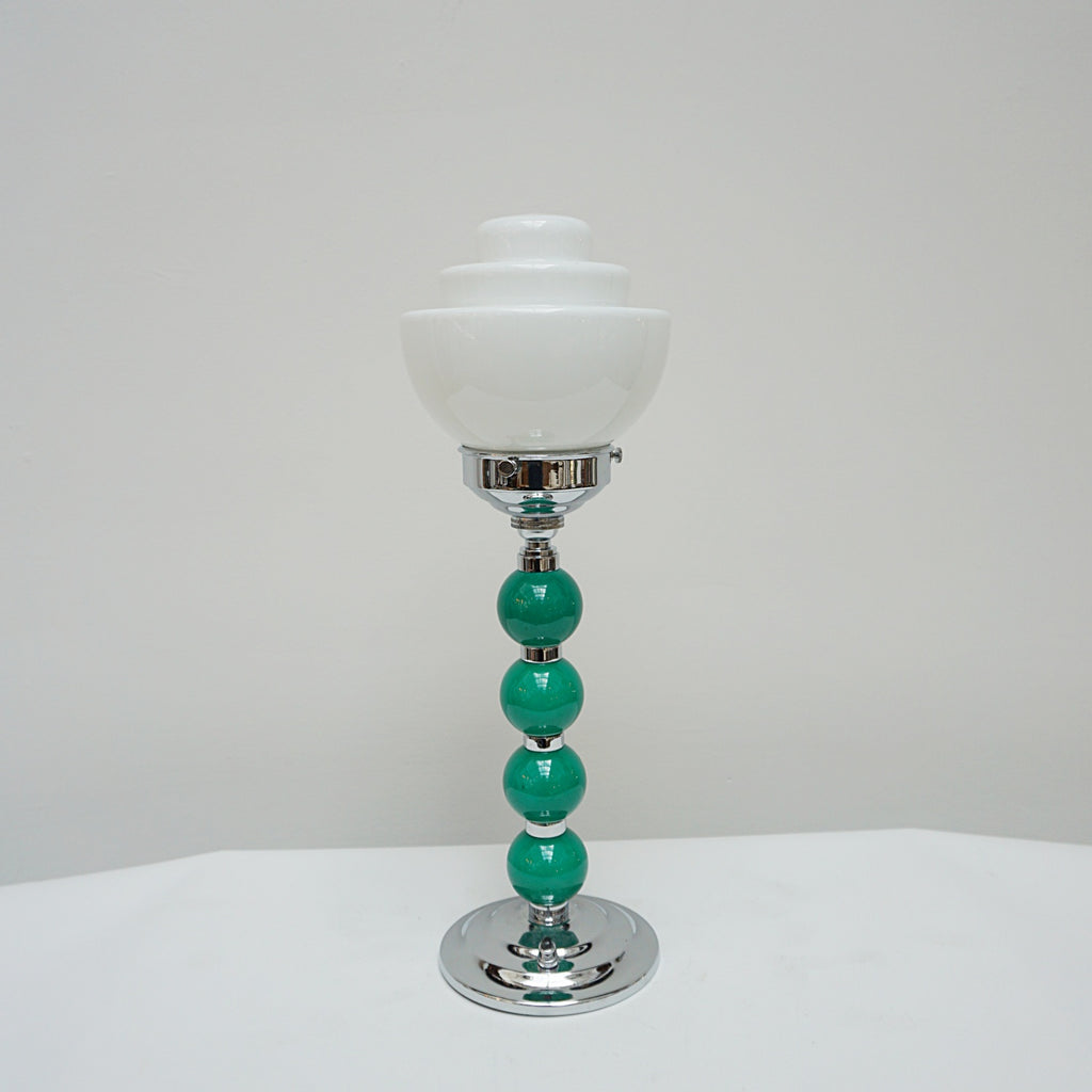 An Art Deco table lamp. Green bakelite balls with chromed banding to stem. Set over stepped circular base - Jeroen m
