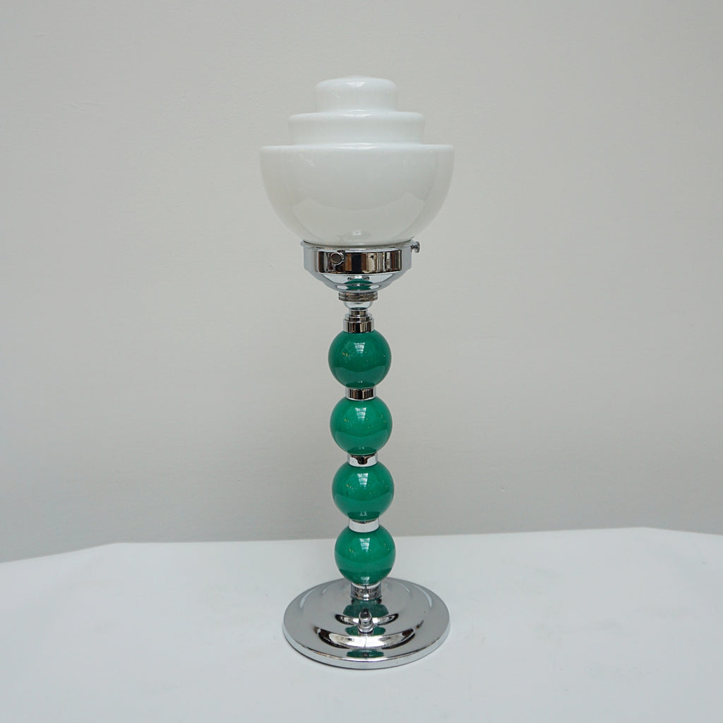 An Art Deco table lamp. Green bakelite balls with chromed banding to stem. Set over stepped circular base - Jeroen m