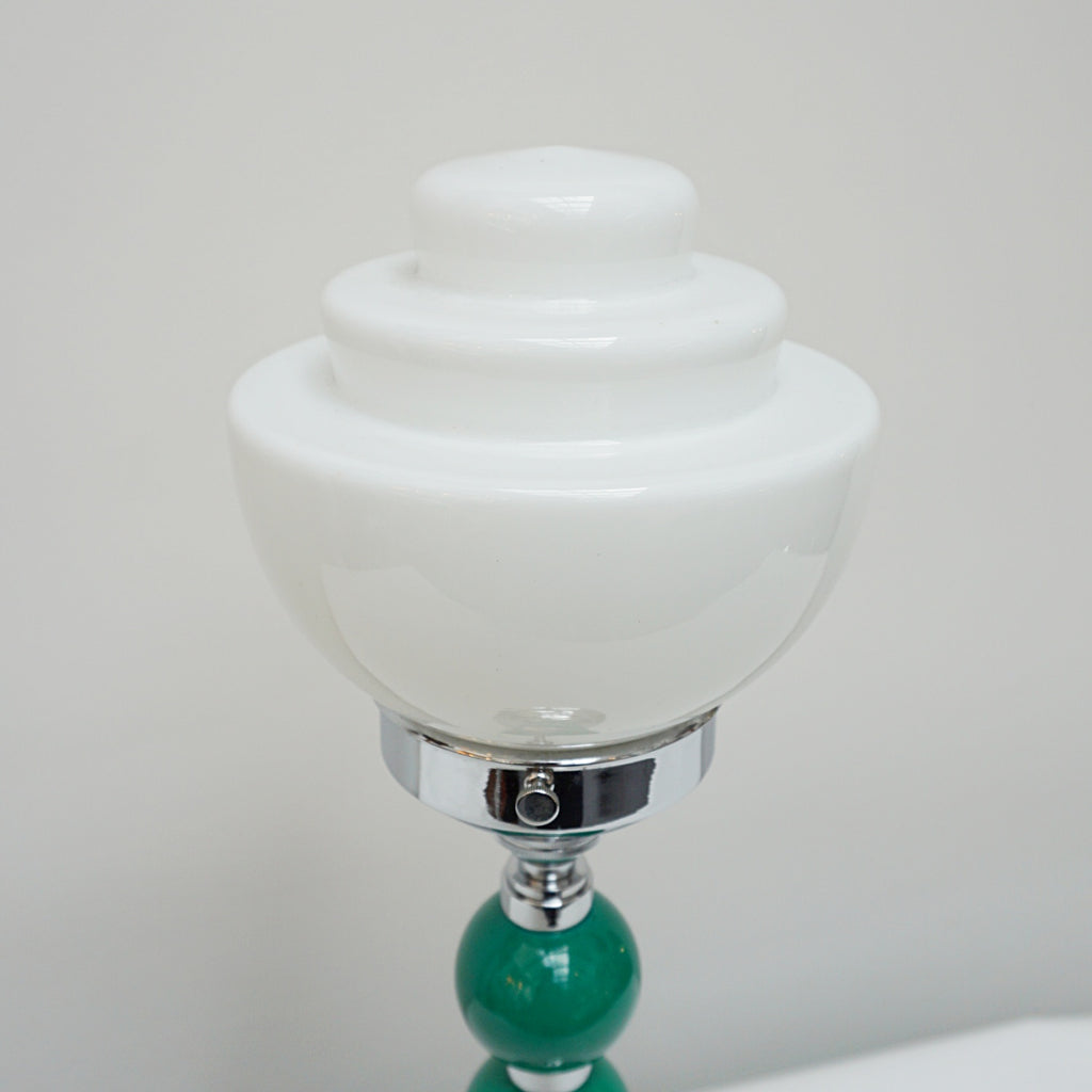 An Art Deco table lamp. Green bakelite balls with chromed banding to stem. Set over stepped circular base - Jeroen m