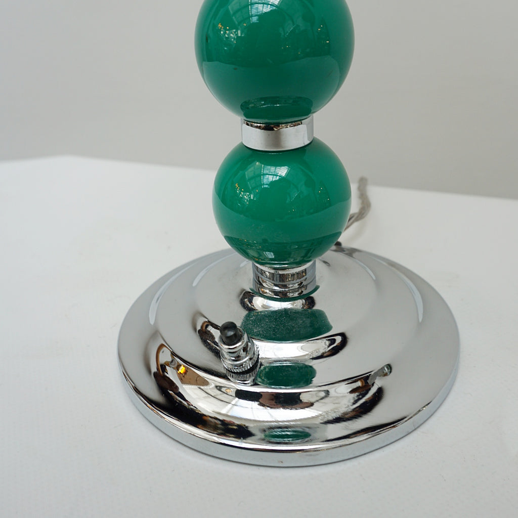 An Art Deco table lamp. Green bakelite balls with chromed banding to stem. Set over stepped circular base - Jeroen m