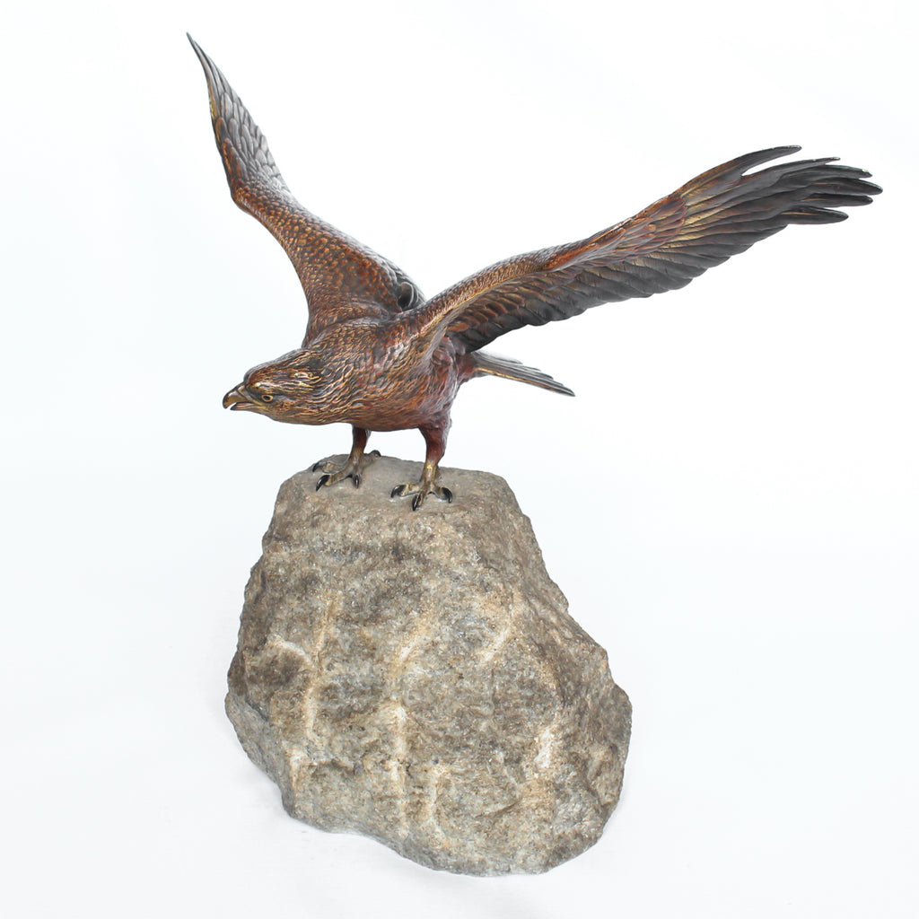 A bronze study of an eagle about to take flight with its wings outspread on the edge of a naturalistic rocky outcrop with excellent colour and fine hand finished detail. Signed with the Bergman ‘B’ to underside of tail at Jeroen Markies.