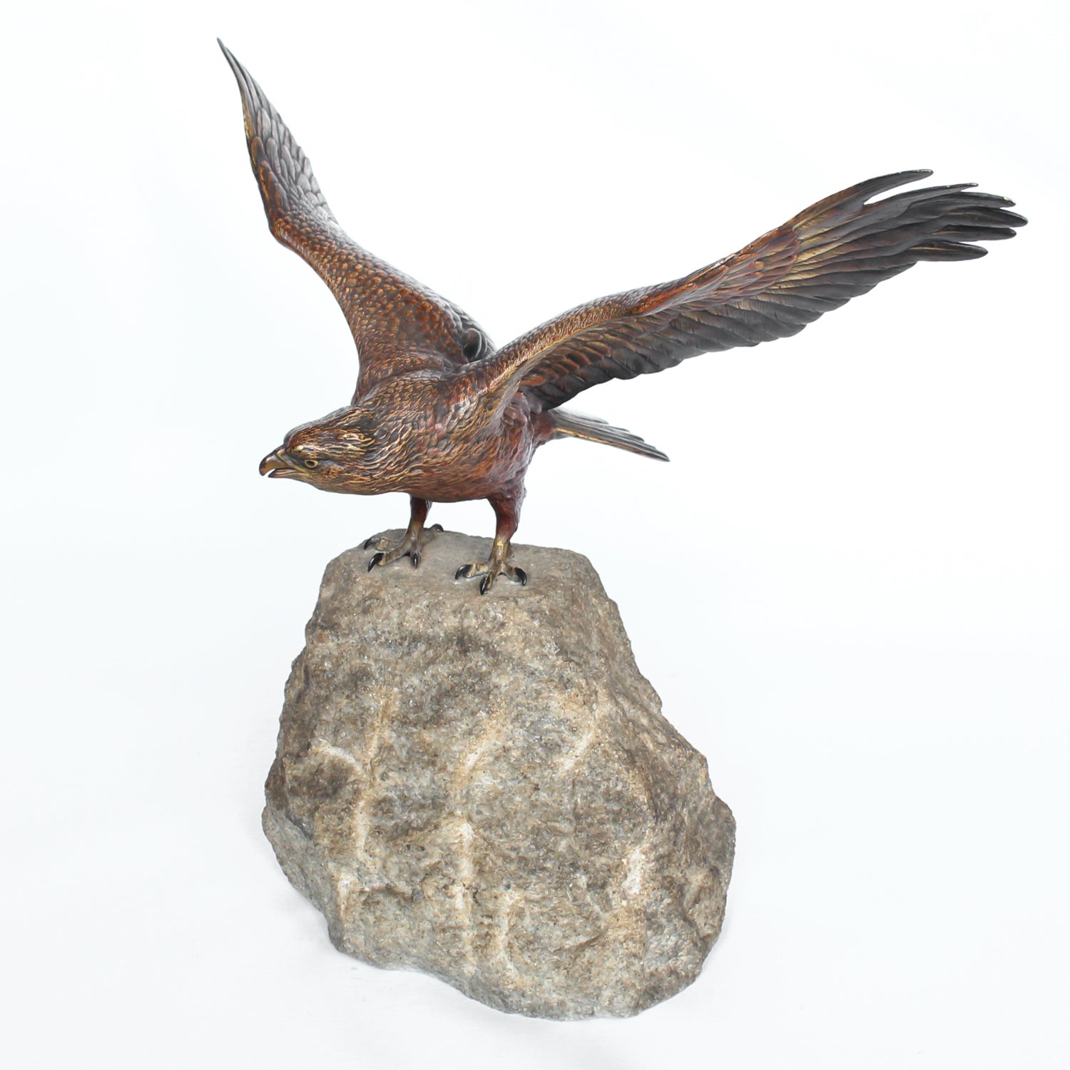 A bronze study of an eagle about to take flight with its wings outspread on the edge of a naturalistic rocky outcrop with excellent colour and fine hand finished detail. Signed with the Bergman ‘B’ to underside of tail at Jeroen Markies.