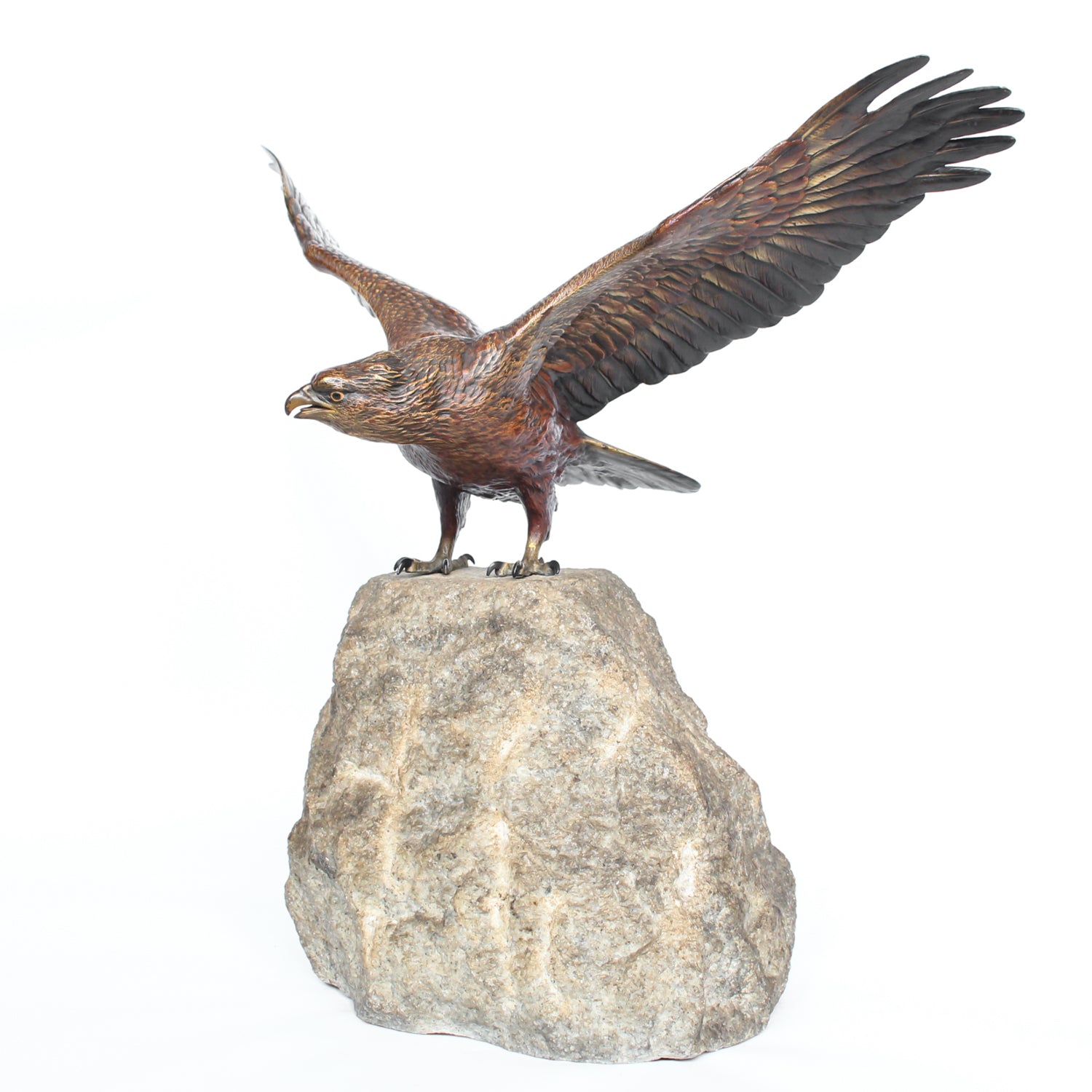 A bronze study of an eagle about to take flight with its wings outspread on the edge of a naturalistic rocky outcrop with excellent colour and fine hand finished detail. Signed with the Bergman ‘B’ to underside of tail at Jeroen Markies.