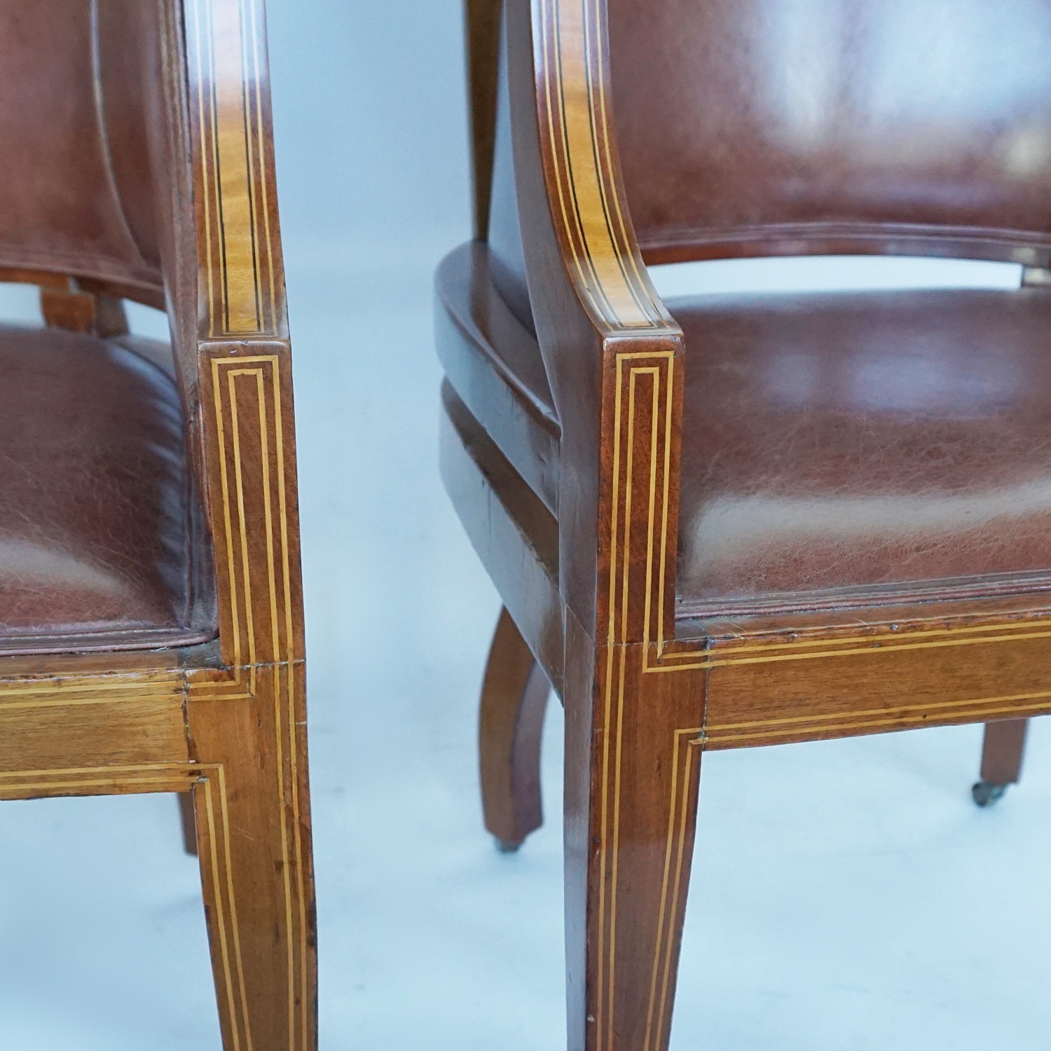 A Pair of Edwardian Armchairs Re-Upholstered in chestnut leather - Jeroen Markies Art Deco
