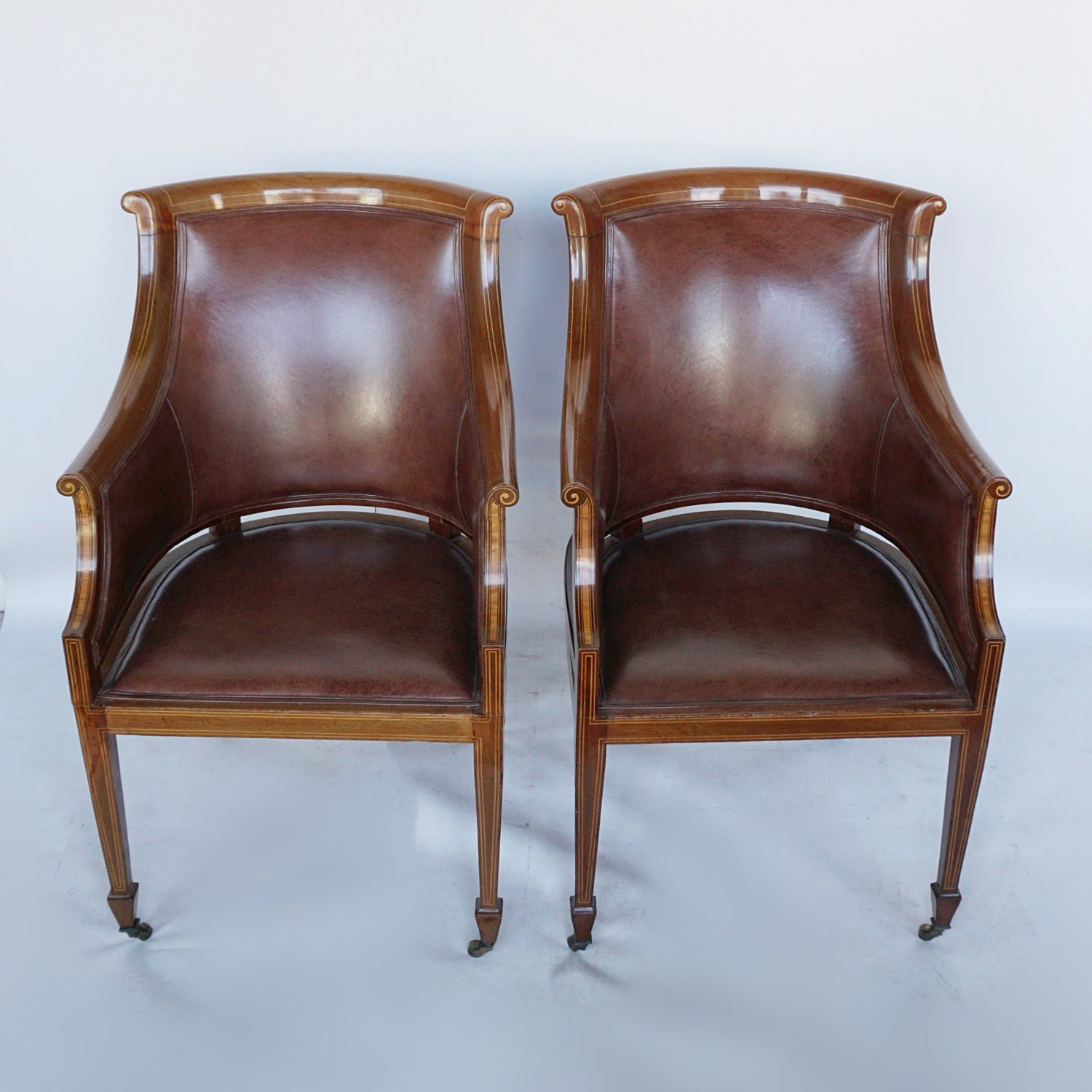 A Pair of Edwardian Armchairs Re-Upholstered in chestnut leather - Jeroen Markies Art Deco