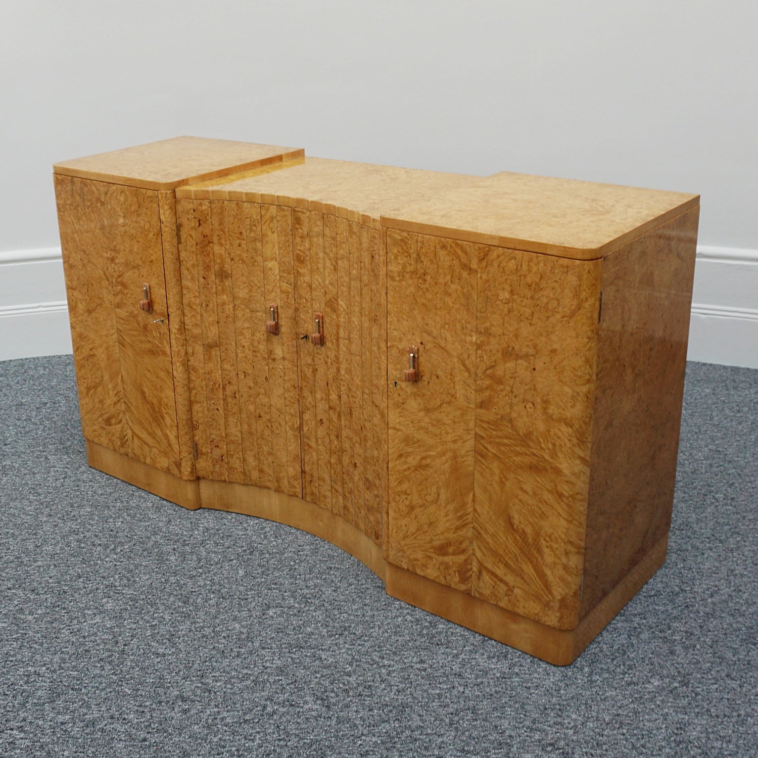 Art Deco Sideboard by Harry & Lou Epstein English Circa 1930 veneered in burr walnut with original bakelite handles. Vintage Art Deco - Jeroen Markies Art Deco