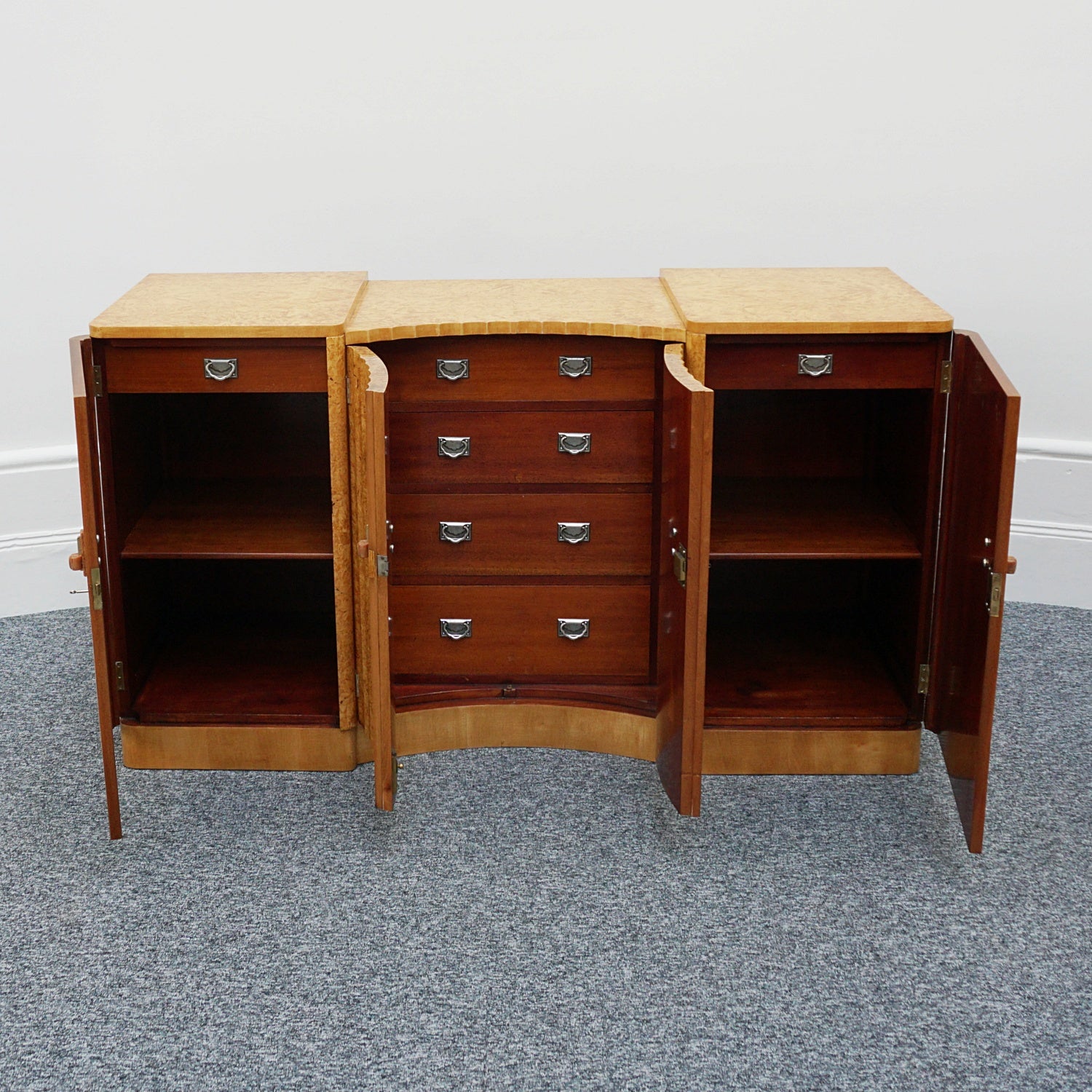 Art Deco Sideboard by Harry & Lou Epstein English Circa 1930 veneered in burr walnut with original bakelite handles. Vintage Art Deco - Jeroen Markies Art Deco
