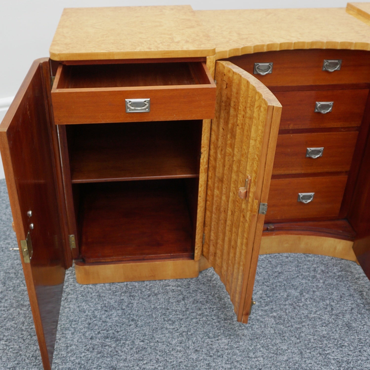 Art Deco Sideboard by Harry & Lou Epstein English Circa 1930 veneered in burr walnut with original bakelite handles. Vintage Art Deco - Jeroen Markies Art Deco