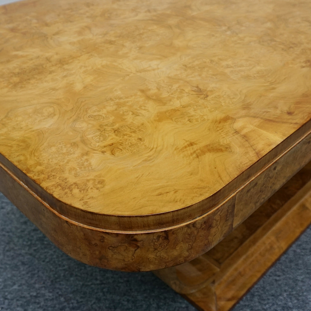 An Art Deco dining table by Harry & Lou Epstein. The table top is burr walnut veneered. 
