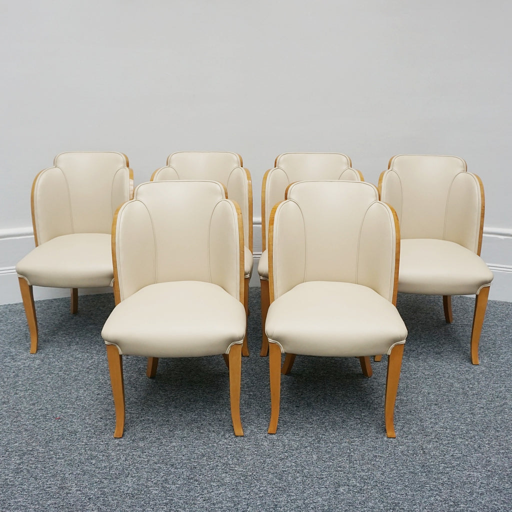 Art Deco cloud backed armchairs upholstered in cream leather by Harry & Lou Epstein. 