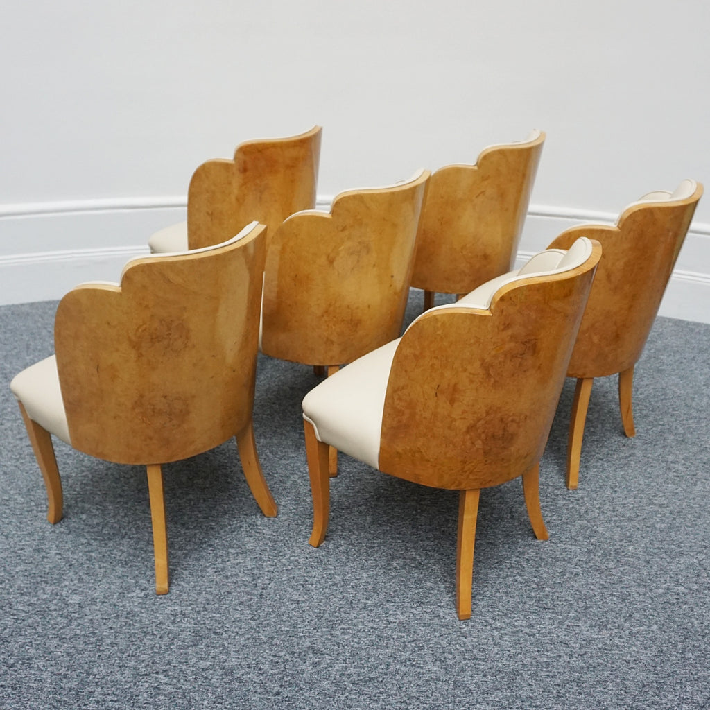 Art Deco cloud backed armchairs upholstered in cream leather by Harry & Lou Epstein. 