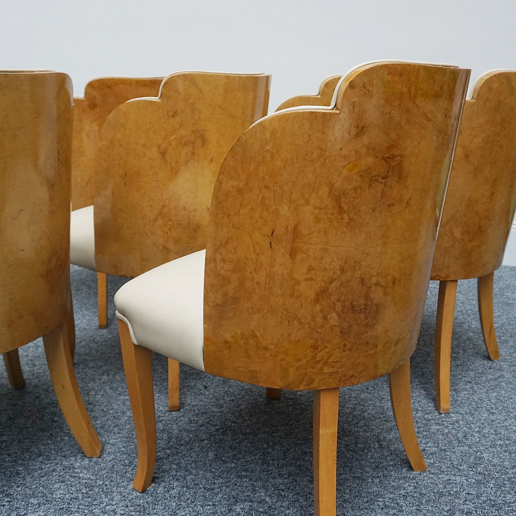 Art Deco cloud backed armchairs upholstered in cream leather by Harry & Lou Epstein. 