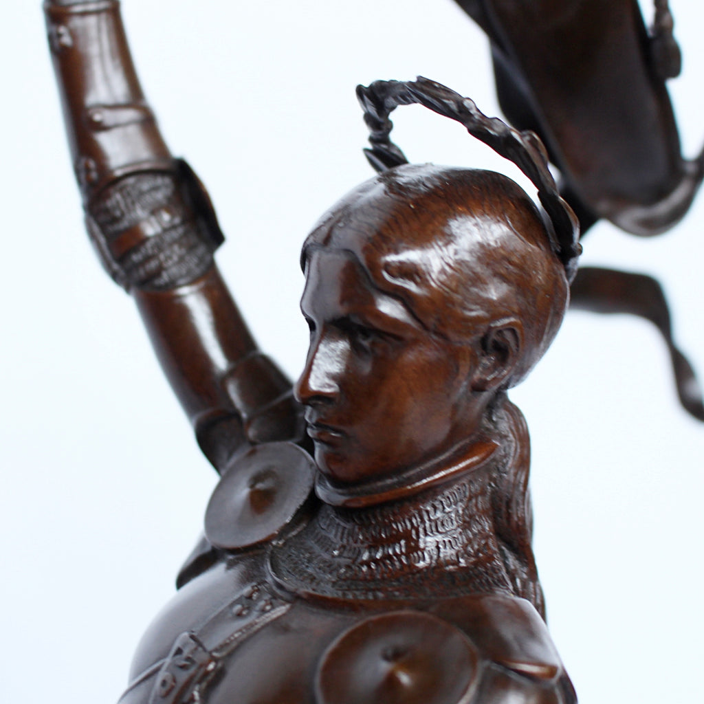 Jeanne d'Arc. A stunning early salon version of the famous Joan of Arc in the Place des Pyramides in Paris. Wonderful rich brown patina and stunning hand chased detail and characterisation. Set on an integral, naturalistic plinth. Signed E Fremiet to cast at Jeroen Markies