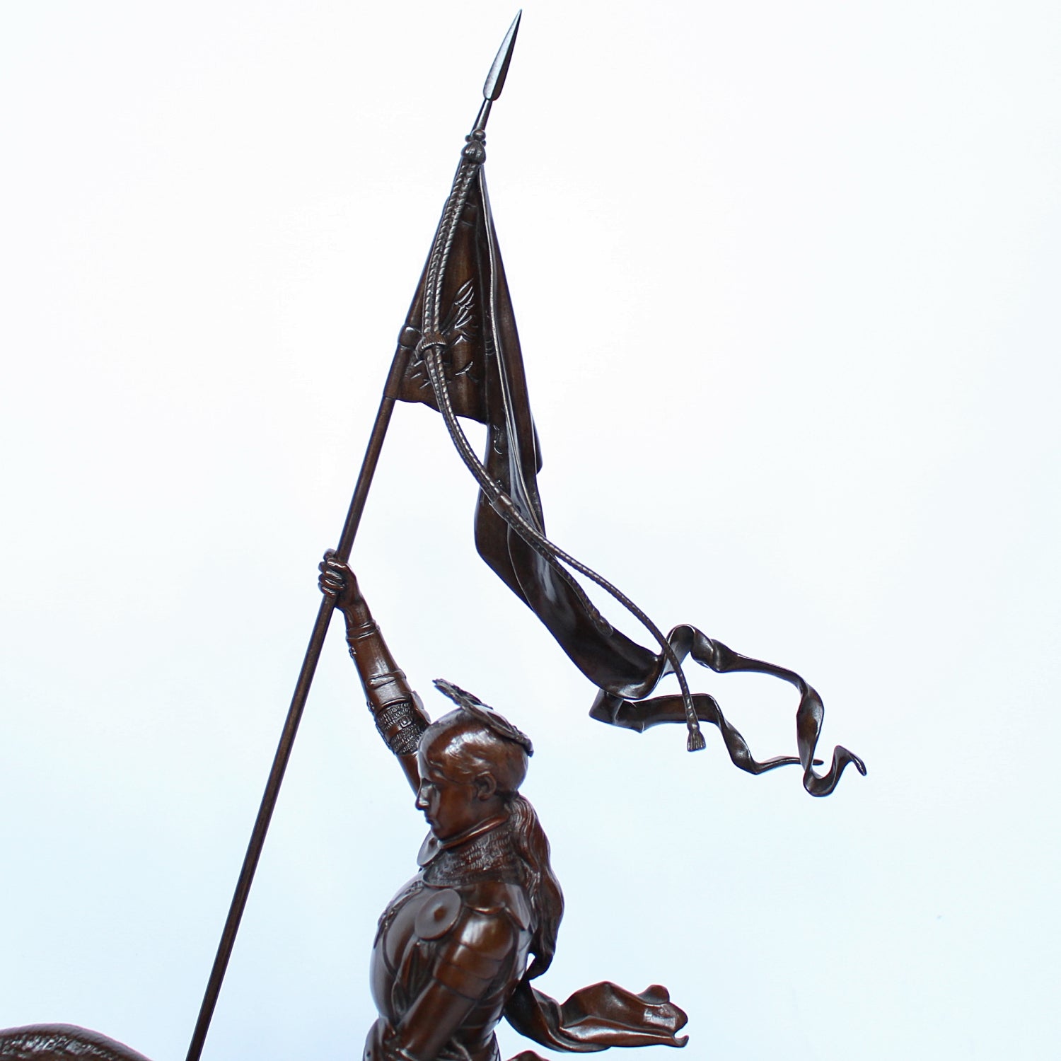 Jeanne d'Arc. A stunning early salon version of the famous Joan of Arc in the Place des Pyramides in Paris. Wonderful rich brown patina and stunning hand chased detail and characterisation. Set on an integral, naturalistic plinth. Signed E Fremiet to cast at Jeroen Markies