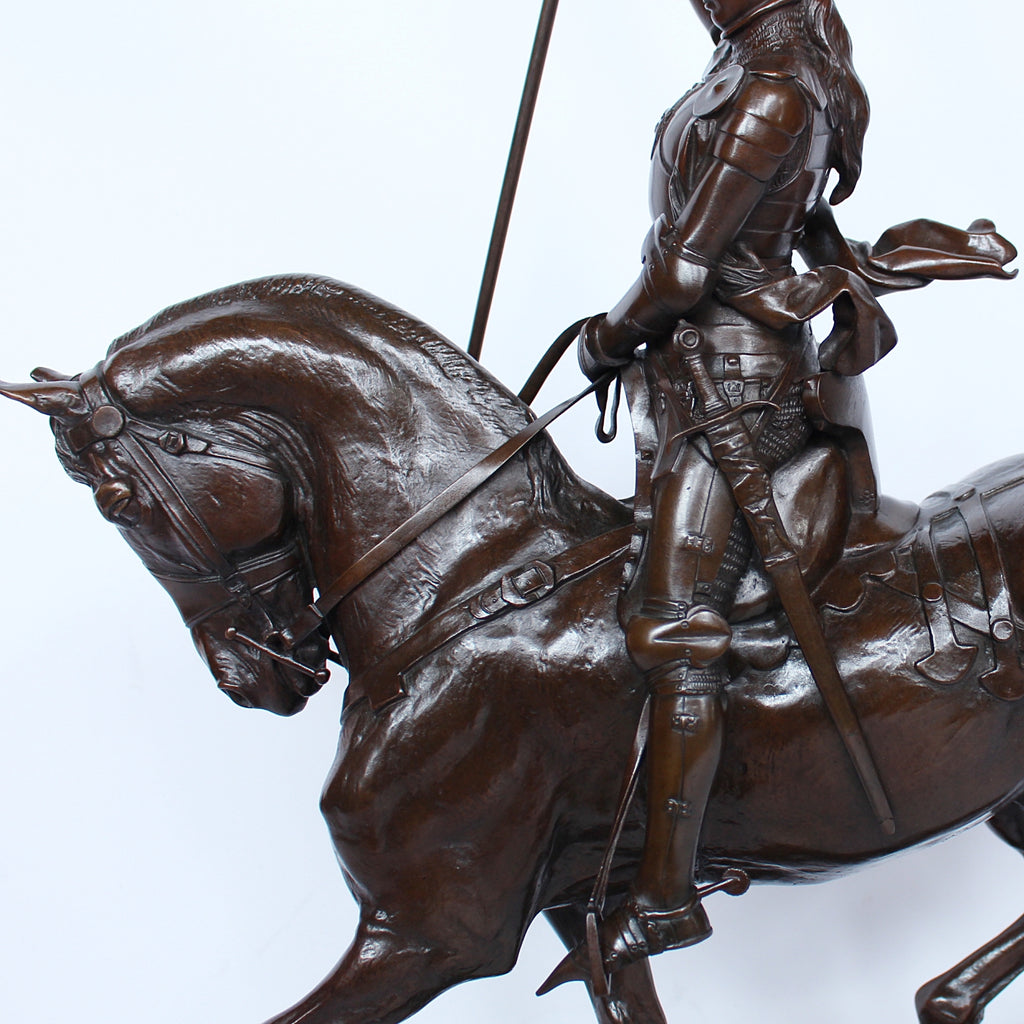 Jeanne d'Arc. A stunning early salon version of the famous Joan of Arc in the Place des Pyramides in Paris. Wonderful rich brown patina and stunning hand chased detail and characterisation. Set on an integral, naturalistic plinth. Signed E Fremiet to cast at Jeroen Markies
