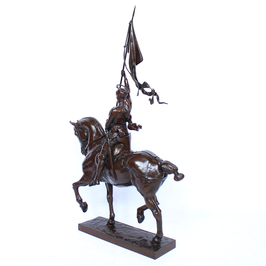 Jeanne d'Arc. A stunning early salon version of the famous Joan of Arc in the Place des Pyramides in Paris. Wonderful rich brown patina and stunning hand chased detail and characterisation. Set on an integral, naturalistic plinth. Signed E Fremiet to cast at Jeroen Markies