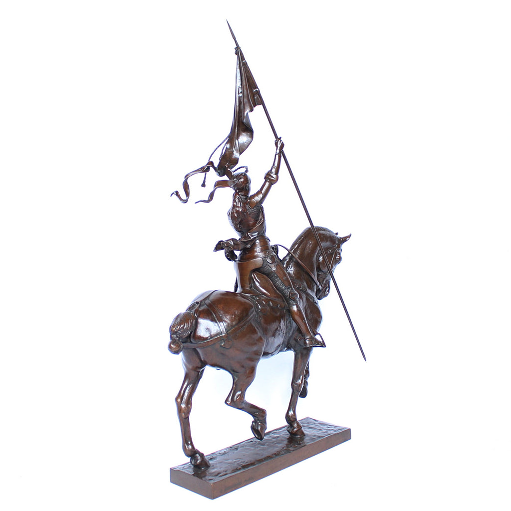 Jeanne d'Arc. A stunning early salon version of the famous Joan of Arc in the Place des Pyramides in Paris. Wonderful rich brown patina and stunning hand chased detail and characterisation. Set on an integral, naturalistic plinth. Signed E Fremiet to cast at Jeroen Markies