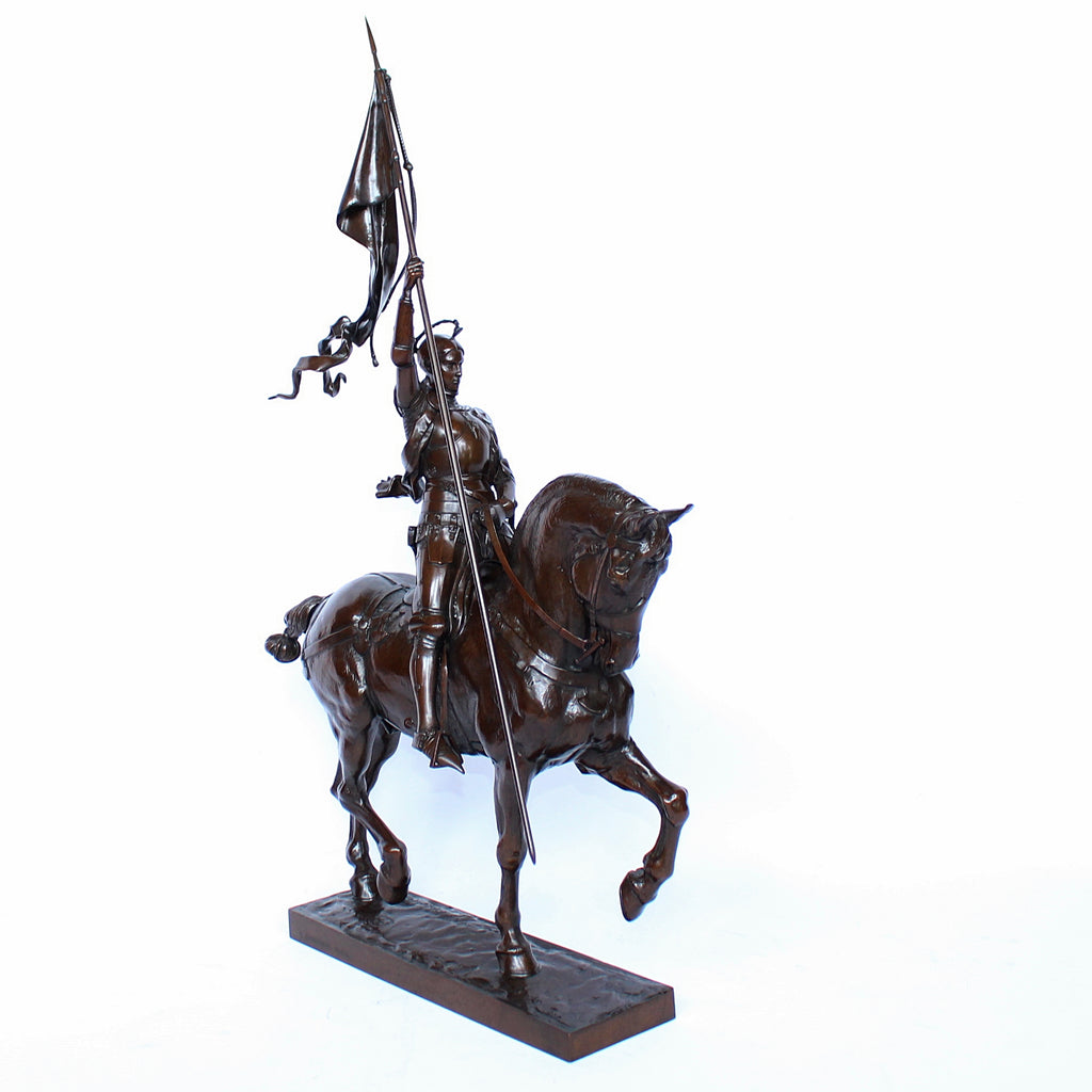 Jeanne d'Arc. A stunning early salon version of the famous Joan of Arc in the Place des Pyramides in Paris. Wonderful rich brown patina and stunning hand chased detail and characterisation. Set on an integral, naturalistic plinth. Signed E Fremiet to cast at Jeroen Markies