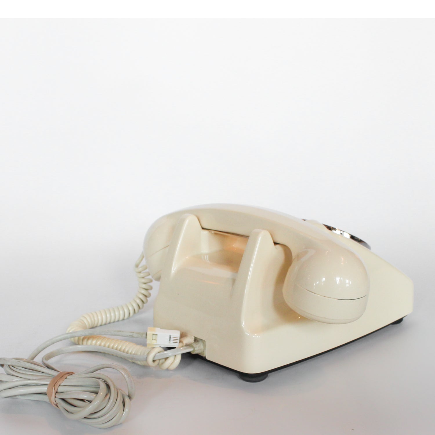An original GPO model 706 telephone in cream at Jeroen Markies