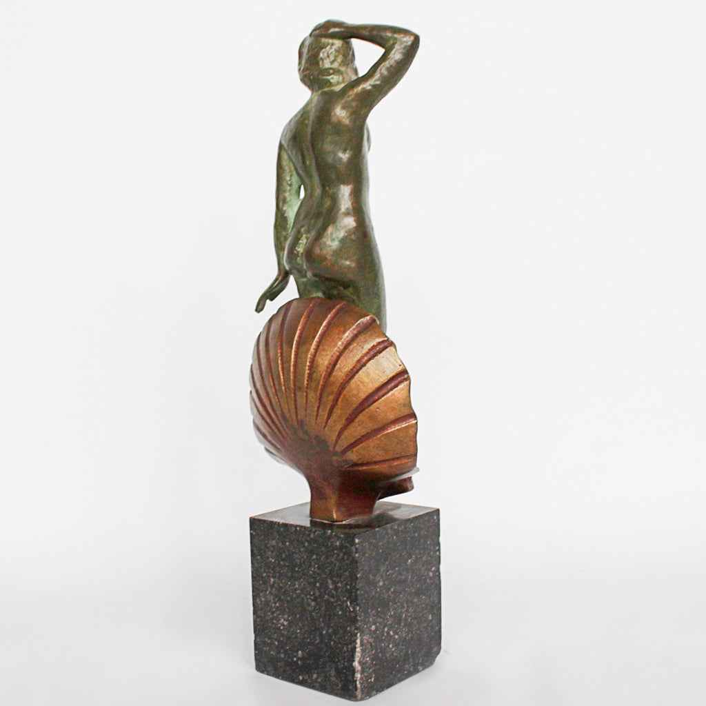 Venus, an Art Deco verdigris patinated and cold painted bronze sculpture. Depicts the figure of Venus emerging, set over a marble plinth. Chips to marble at Jeroen Markies