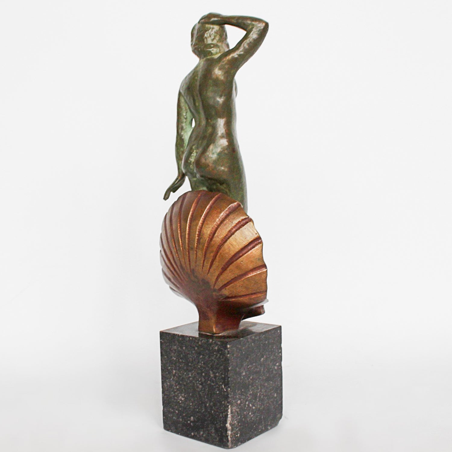 Venus, an Art Deco verdigris patinated and cold painted bronze sculpture. Depicts the figure of Venus emerging, set over a marble plinth. Chips to marble at Jeroen Markies
