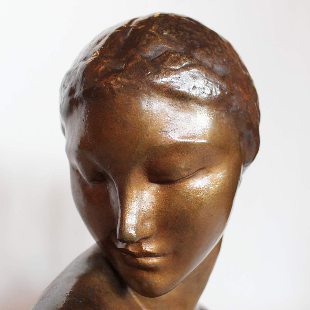 Amadeo Gennarelli Art Deco bronze bust of a young woman set over a wooden plinth at Jeroen Markies