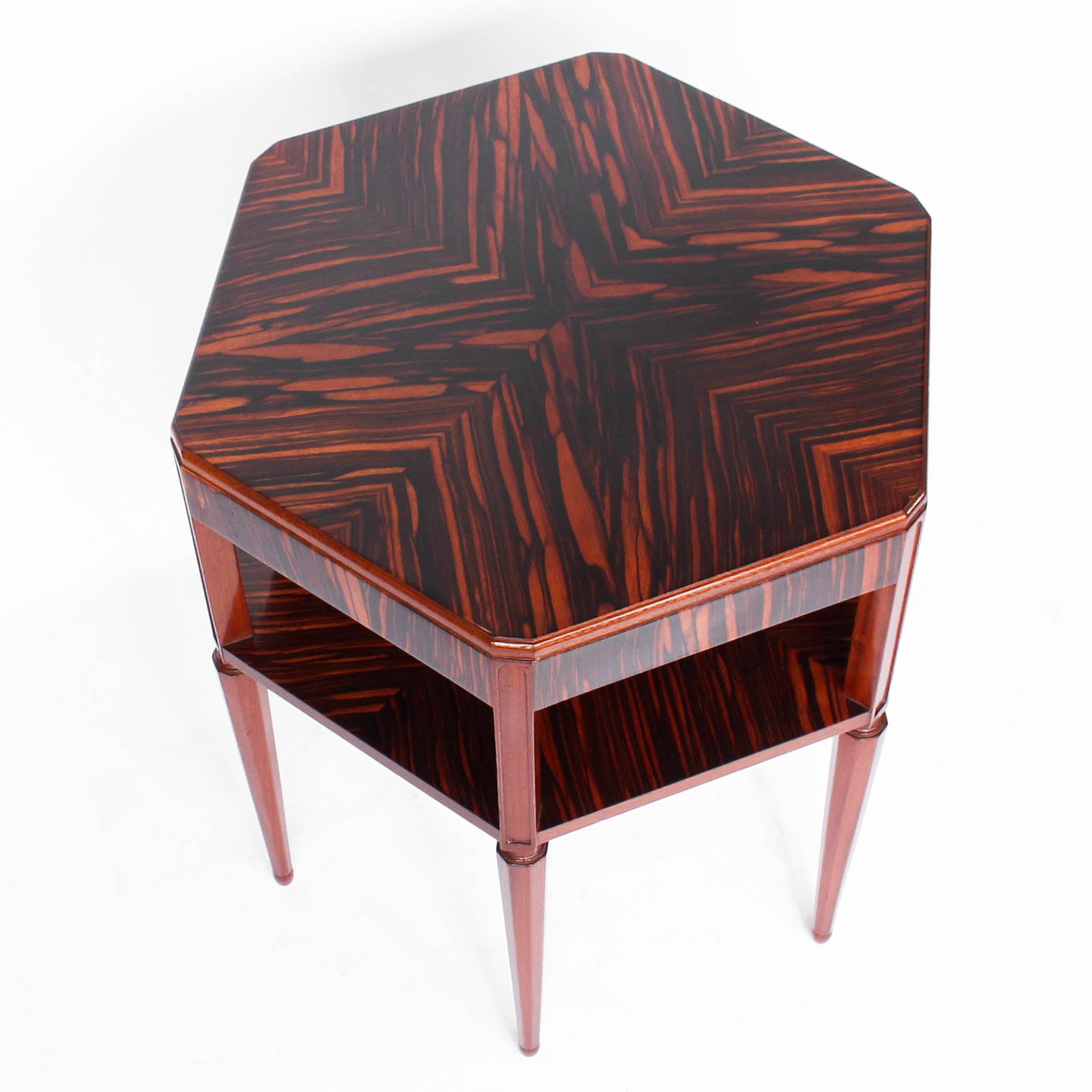 A solid, mahogany hexagonal side/centre table with macassar ebony veneer, quarter veneer to top, second tier and solid mahogany legs at Jeroen Markies