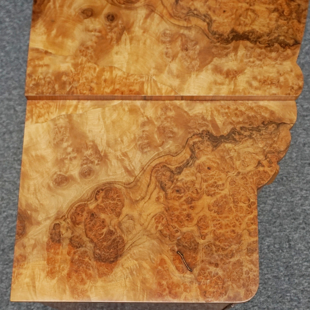 An Art Deco Sideboard by Harry & Lou Epstein with fluted sides set over a curved walnut base made of solid mahogany with burr walnut veneer