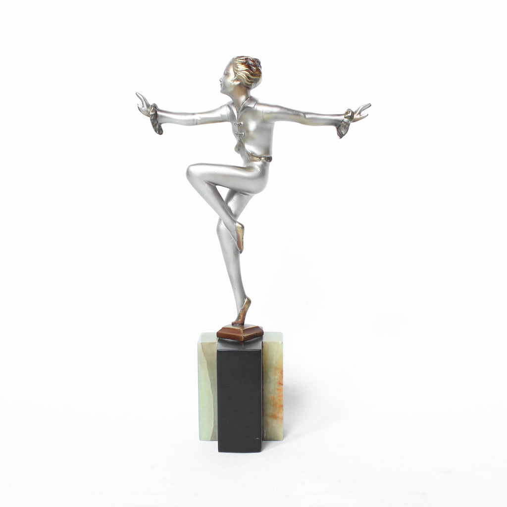 An Art Deco, cold painted bronze figure by Josef Lorenzl (1892-1950). A dancing woman in stylised pose set over a green onyx plinth at Jeroen Markies