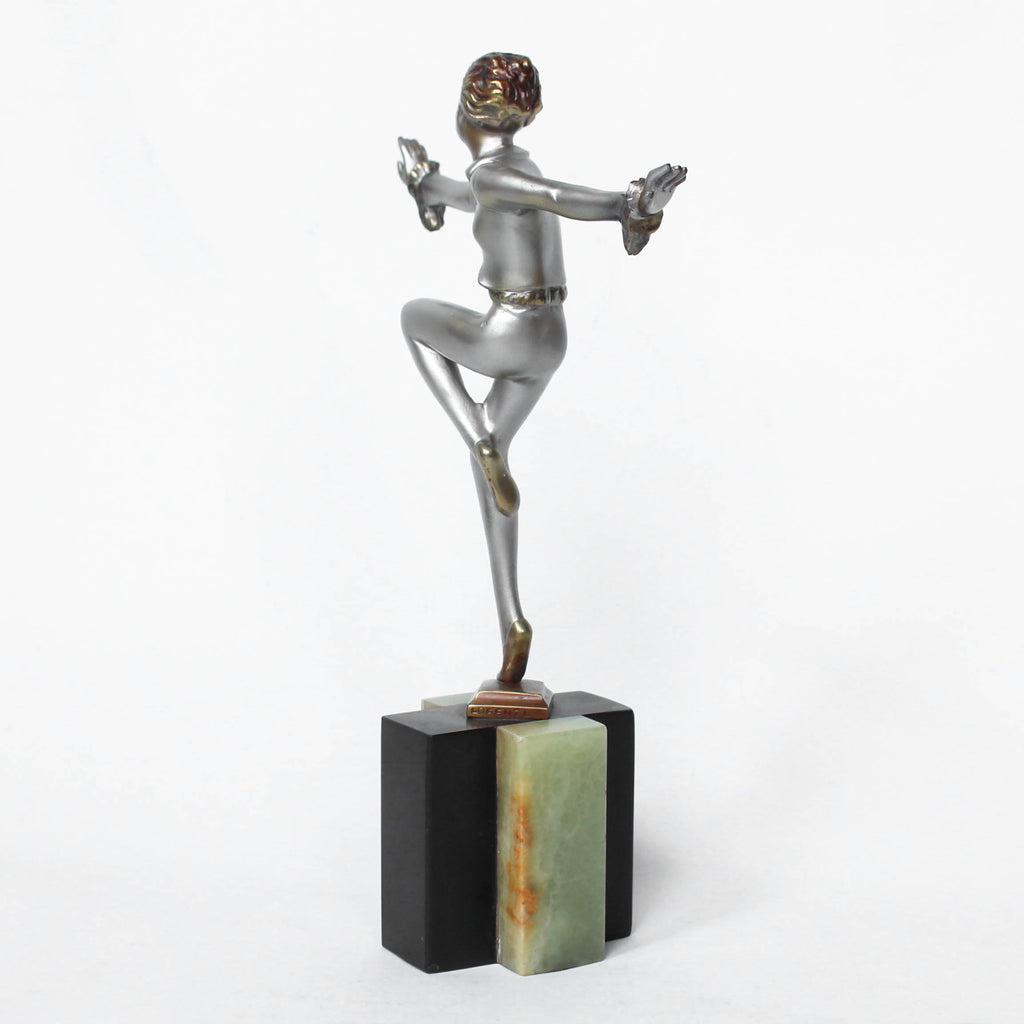 An Art Deco, cold painted bronze figure by Josef Lorenzl (1892-1950). A dancing woman in stylised pose set over a green onyx plinth at Jeroen Markies